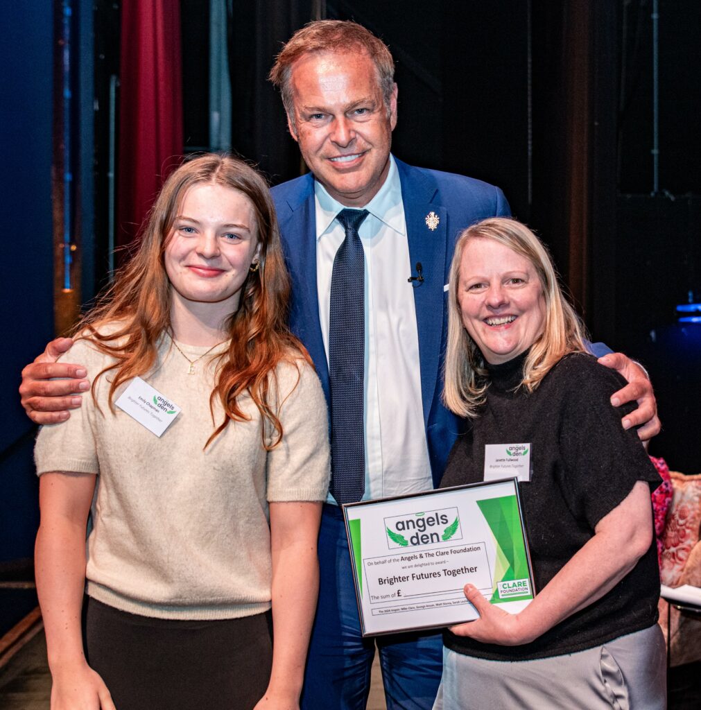 Brighter Futures Together receiving their award from Peter Jones