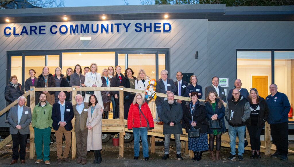 Guests standing on the steps in front of The Clare Community Shed